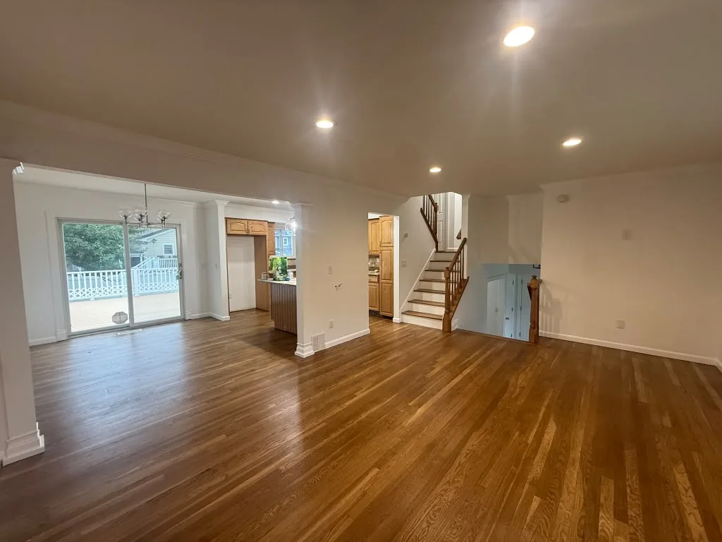 Open living space with refinished hardwood floors