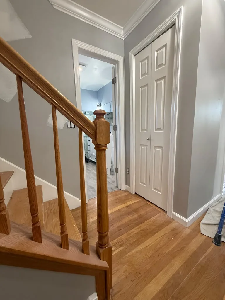 Refinished staircase with wood handrail