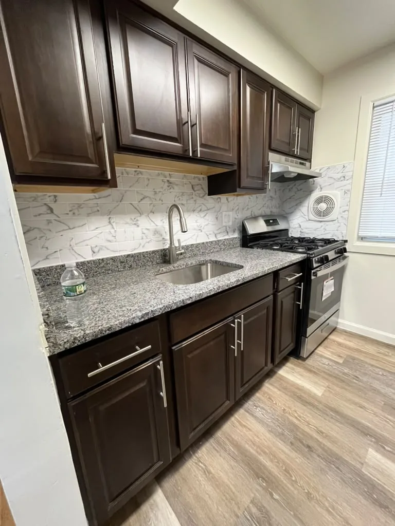 Espresso kitchen with granite counters and stainless range